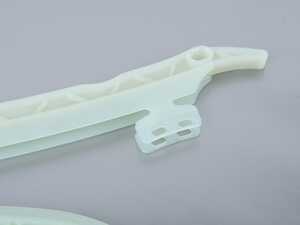 Lower Timing Chain Tensioner With Guide Rail